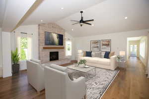 Family room featuring plenty of natural light, a fireplace, LVP floors, high vaulted ceiling, and recessed lighting - Virtual Staging.