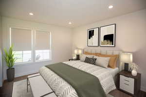 Bedroom featuring ensuite full bathroom, recessed lighting and dark colored carpet - Virtual Staging.