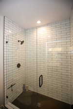Bathroom with a oversize shower and recessed lighting