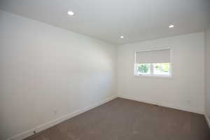 Bedroom with recessed lighting and dark carpet, with jack and jill bathroom