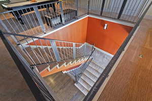 Stairway featuring wood finished floors and baseboards