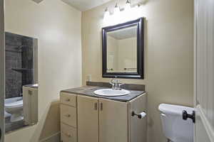 Bathroom with vanity and  shower combination