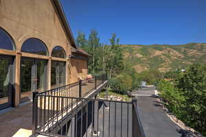 Patio / terrace featuring a mountain view and french doors