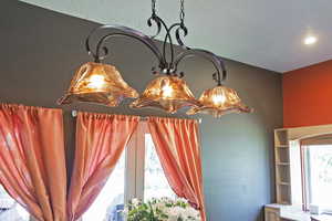 Detailed view of a chandelier and a textured ceiling