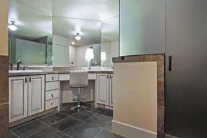 Bathroom with a sink and a textured ceiling