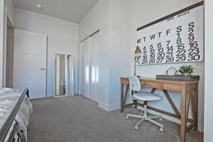 Home office with carpet flooring