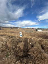 View of yard featuring a view of countryside and an outbuilding