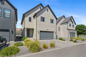 Modern farmhouse with driveway and a garage