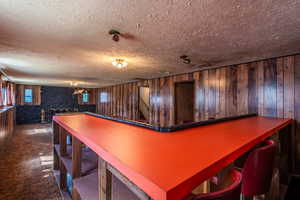 Large dining space/dry bar. with lots of shelving underneath.