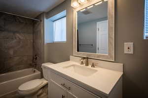 Full bathroom with bathing tub / shower combination and vanity. Large extra side for shelves, vanity mirror, storage etc.