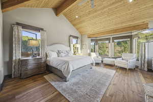 Bedroom with a wooden ceiling with exposed beams, dark wood-type flooring, high vaulted ceiling, and a ceiling fan