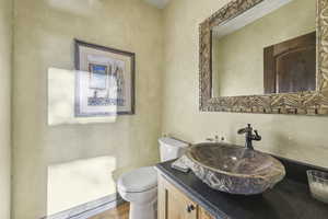 Bathroom featuring vanity and wood finished floors