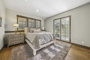 Bedroom featuring recessed lighting and dark wood-style floors