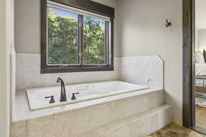 Bathroom featuring a garden tub