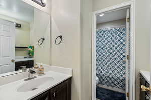 Bathroom featuring vanity and shower / tub combo