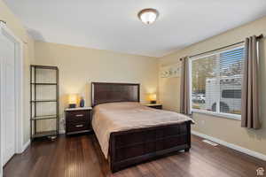 Bedroom featuring dark wood finished floors