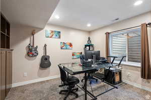 Carpeted home office with baseboards and recessed lighting