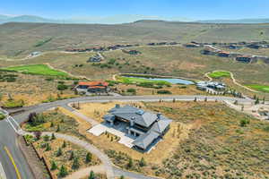 Bird's eye view of a water and mountain view and a golf course