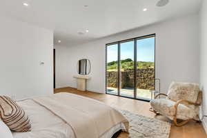 Bedroom featuring recessed lighting, light wood-type flooring, and access to outside