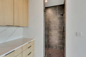 Full bathroom featuring a stall shower
