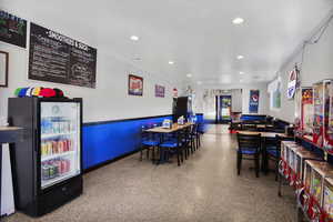 Playroom with recessed lighting and a wainscoted wall