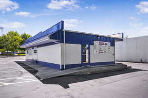 View of side of home featuring concrete block siding