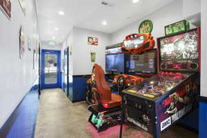Recreation room featuring recessed lighting