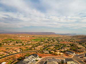 Aerial perspective of suburban area with a mountain backdrop