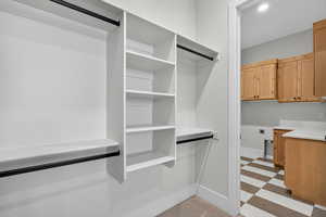Spacious closet with light floors