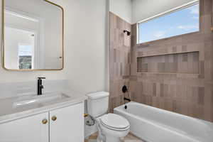 Bathroom featuring shower / tub combination and vanity