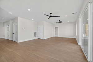 Spare room with recessed lighting, light wood-style floors, and ceiling fan