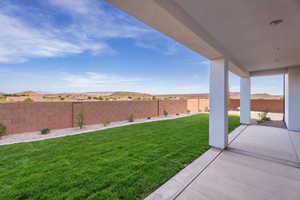 Fenced backyard with a patio and a mountain view