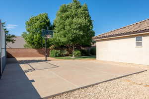 View of sport court featuring basketball hoop