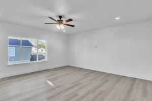 Unfurnished room featuring light wood-style flooring, recessed lighting, and ceiling fan