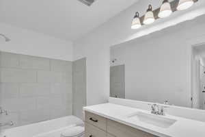 Bathroom with bathtub / shower combination and vanity