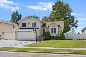 View of front of home with a garage, concrete driveway, brick siding, and a shingled roof
