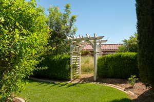 View of green lawn featuring a pergola
