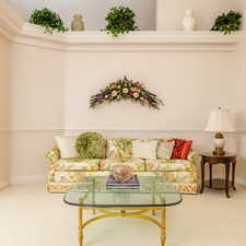 Living room with carpet floors and baseboards