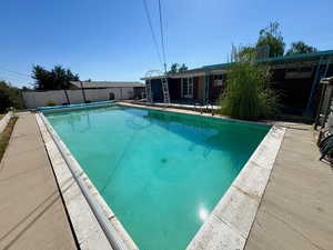 View of pool with a patio area