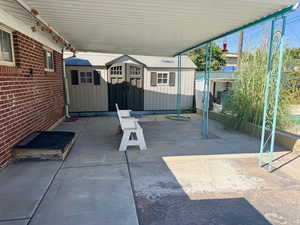 View of patio / terrace with a storage unit