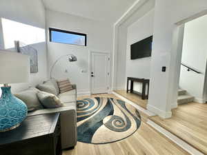 Living area featuring light wood finished floors and stairs