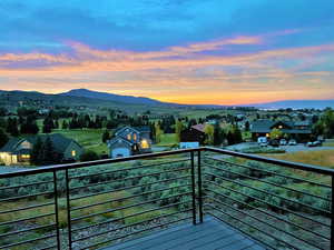Balcony featuring a mountain view and a residential view