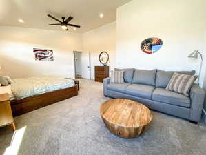 Carpeted bedroom with recessed lighting and ceiling fan
