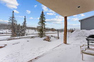 View of yard covered in snow
