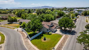 Aerial perspective of suburban area with a mountain backdrop