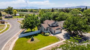 Aerial view of property and surrounding area featuring mountains