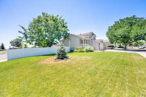 View of front of home with concrete driveway and an attached garage