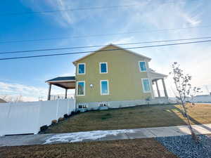 View of side of home featuring a porch