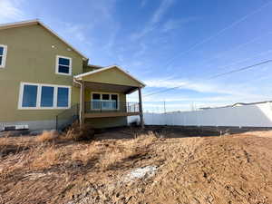 View of side of home with stucco siding