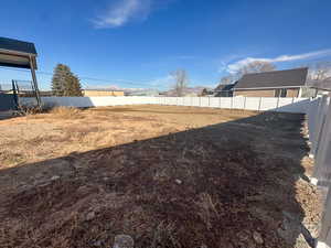 View of fenced backyard